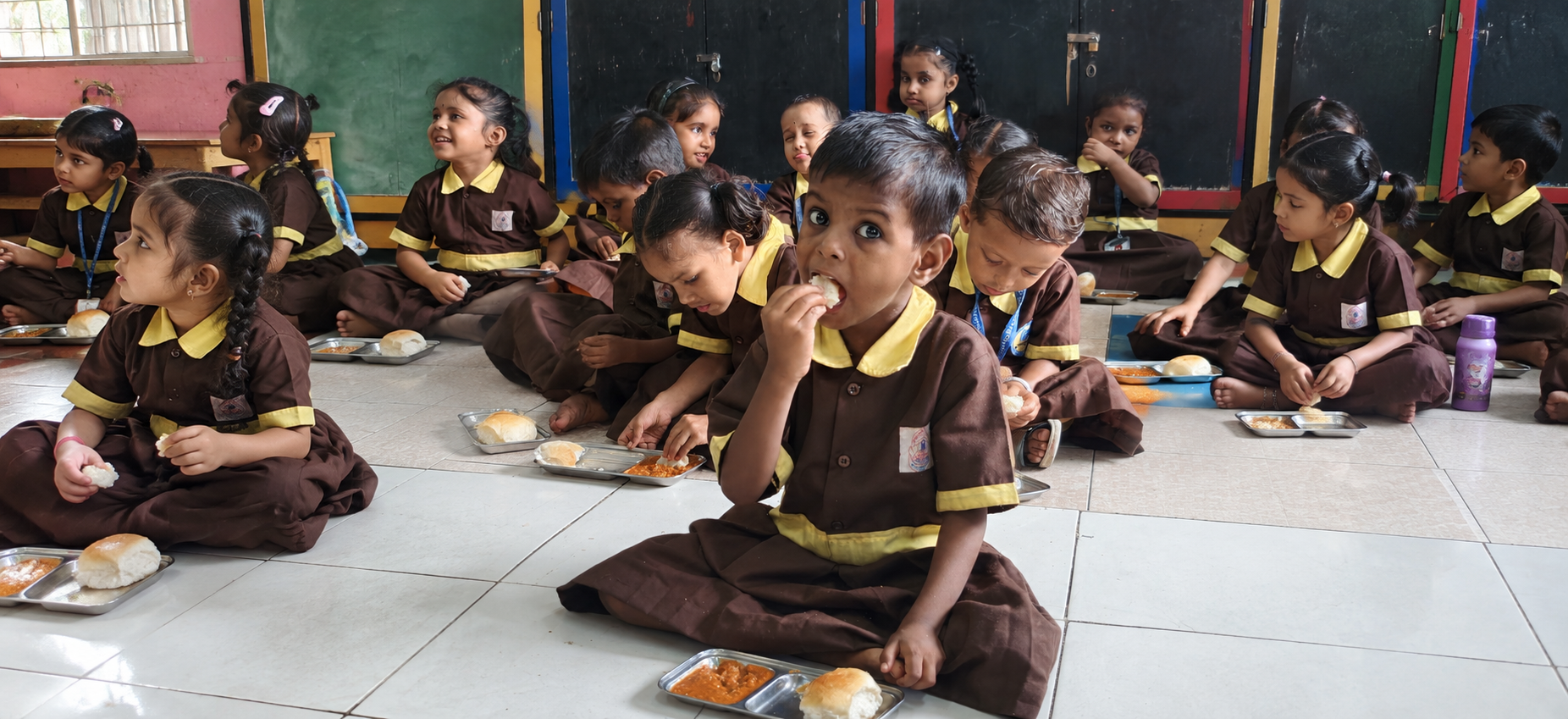 Pre-Primary student eating pav bhaji