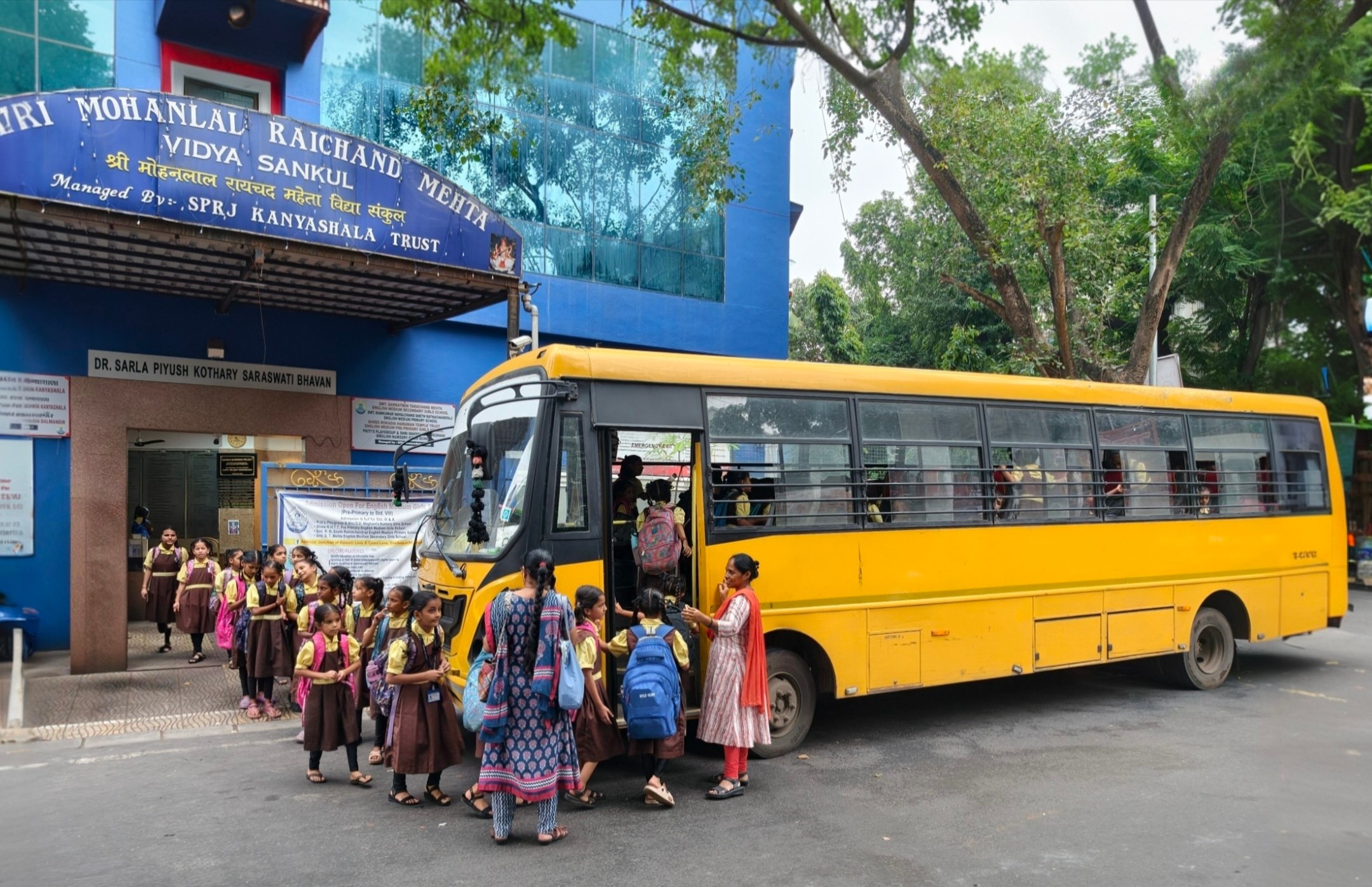 School children getting on the bus
