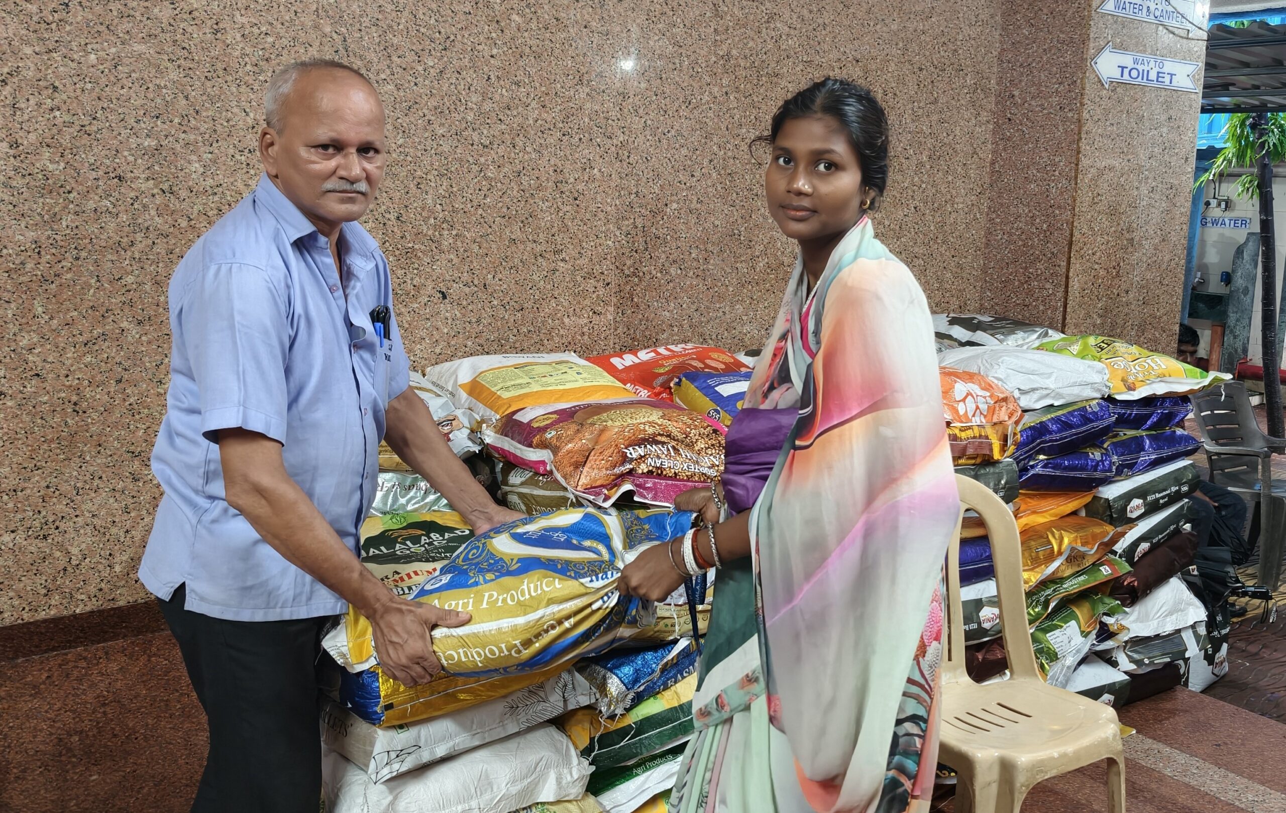 Mother receiving grocery ration